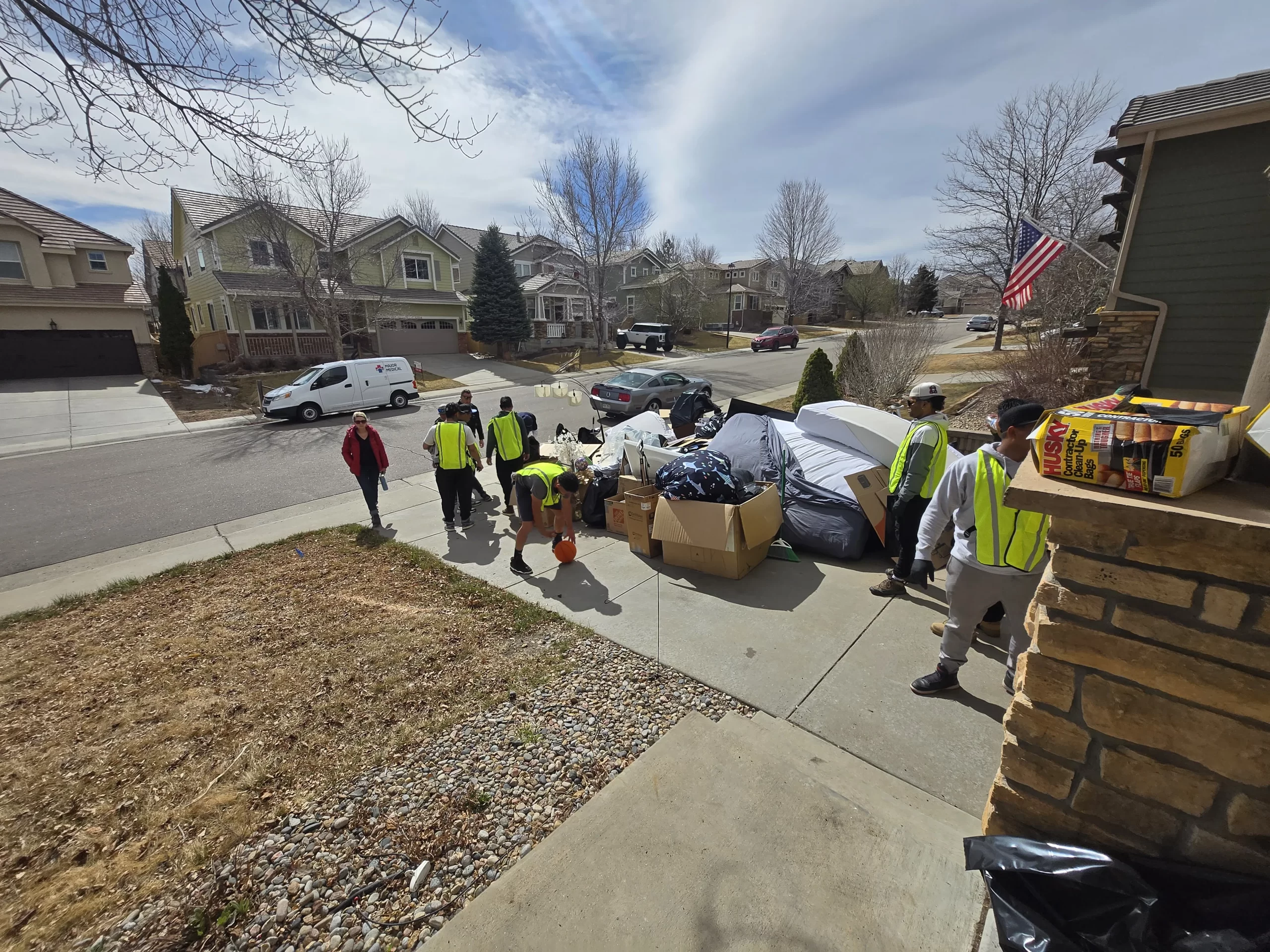 Eviction cleanout crew hauling items - Junk Same Day