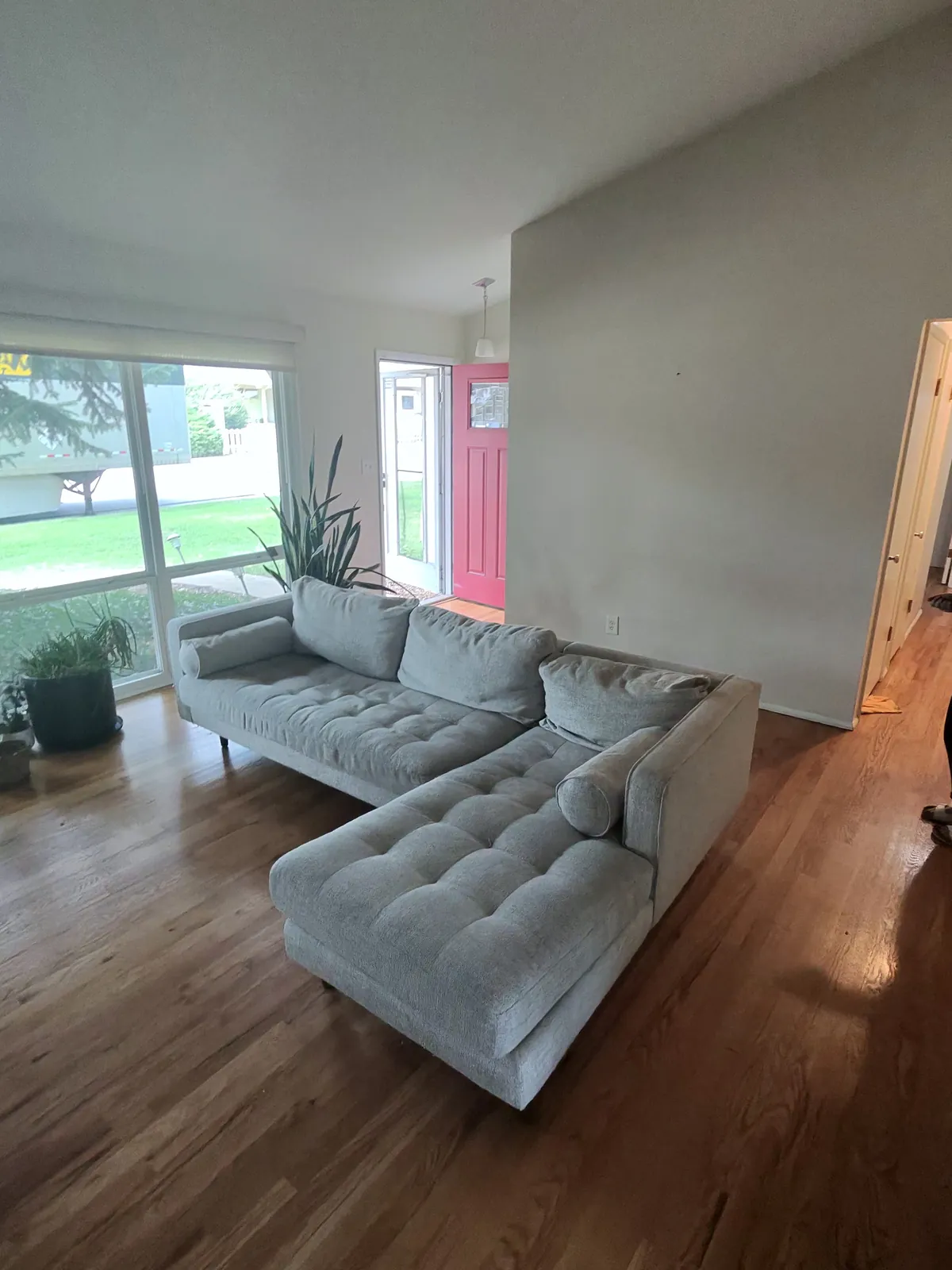 Sectional sofa in a living room before removal